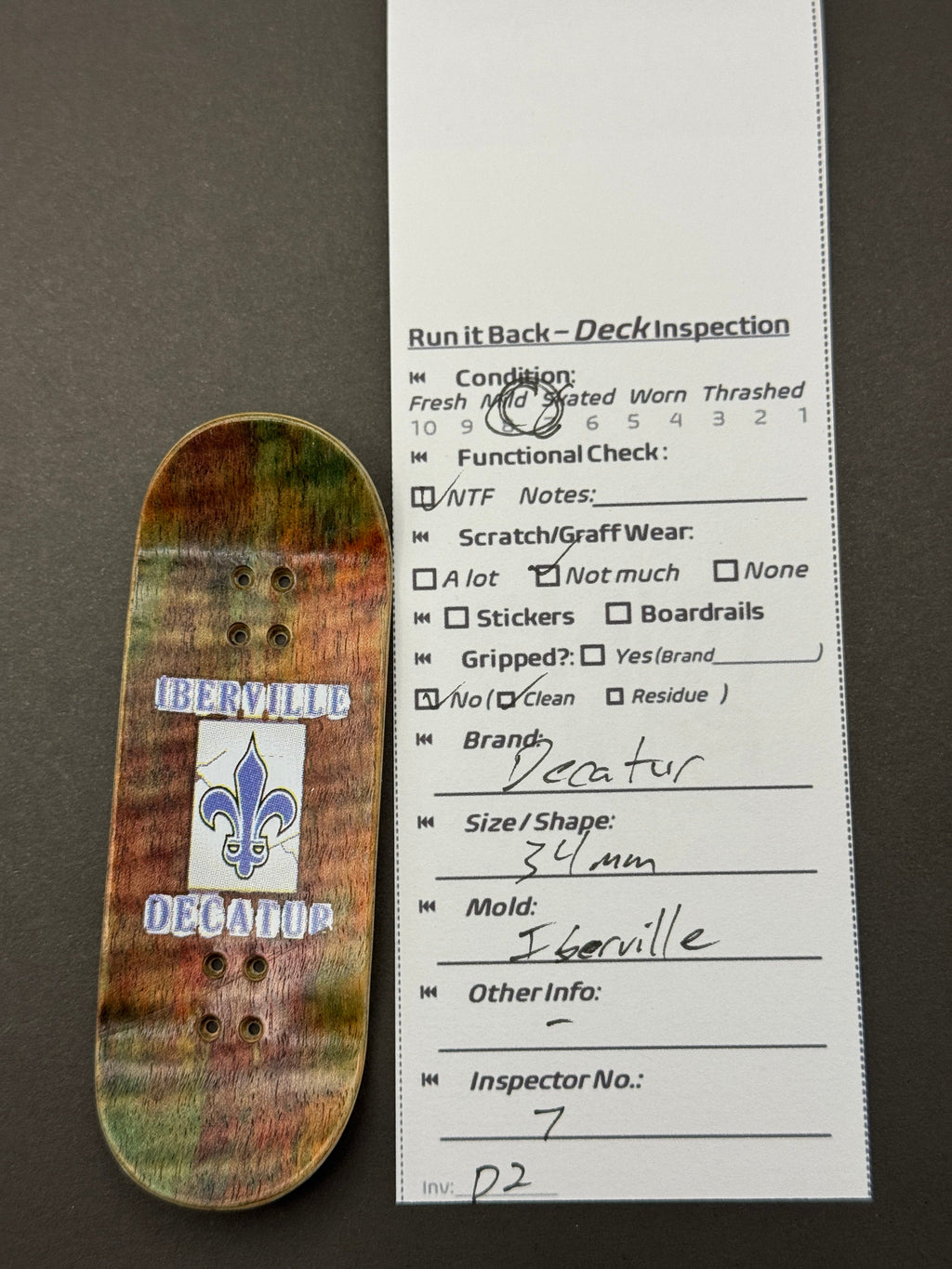 Decatur 34mm Iberville - Skated - Iberville fleur-de-lis bottom with inspection card