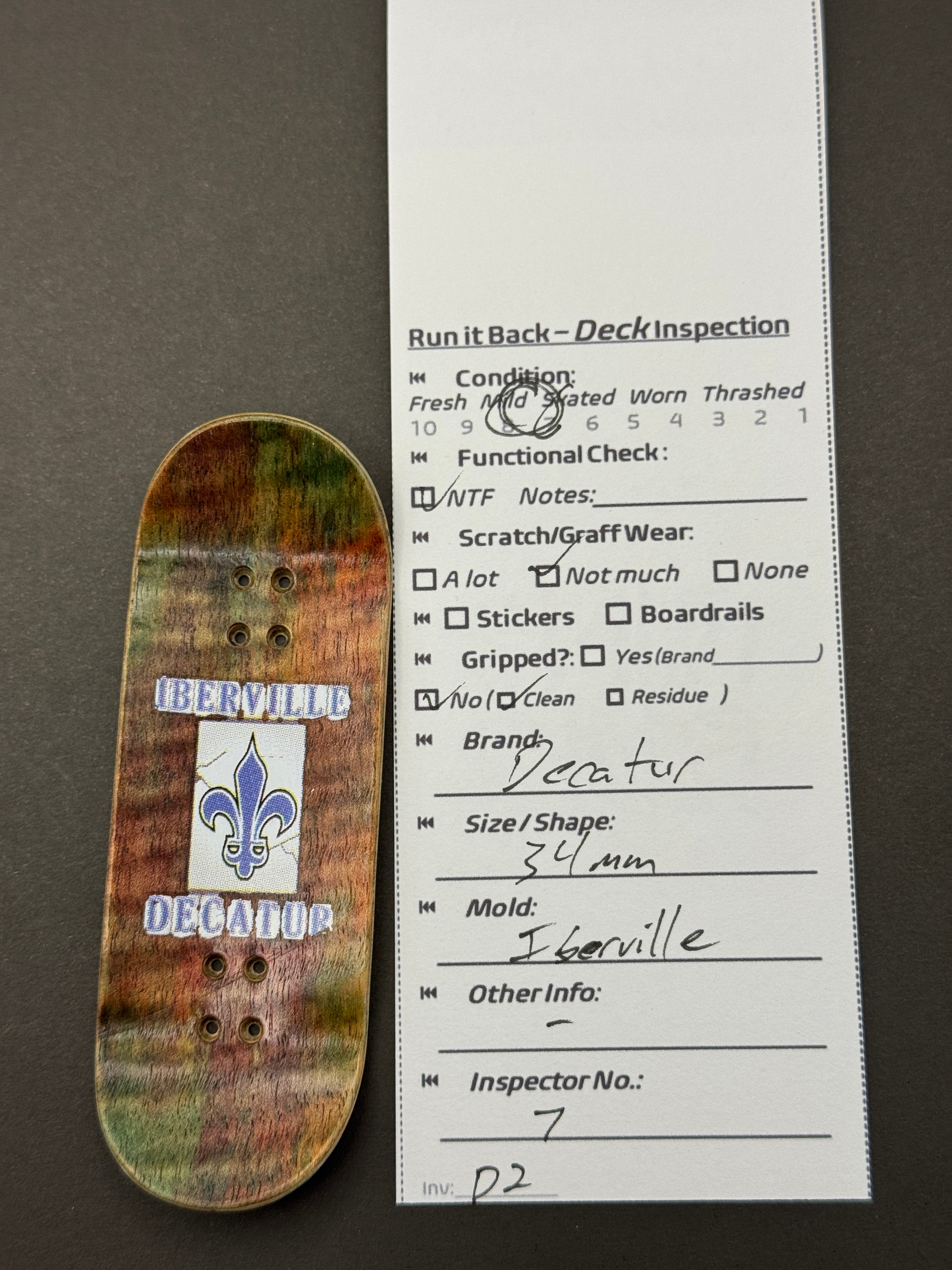 Decatur 34mm Iberville - Skated - Iberville fleur-de-lis bottom with inspection card