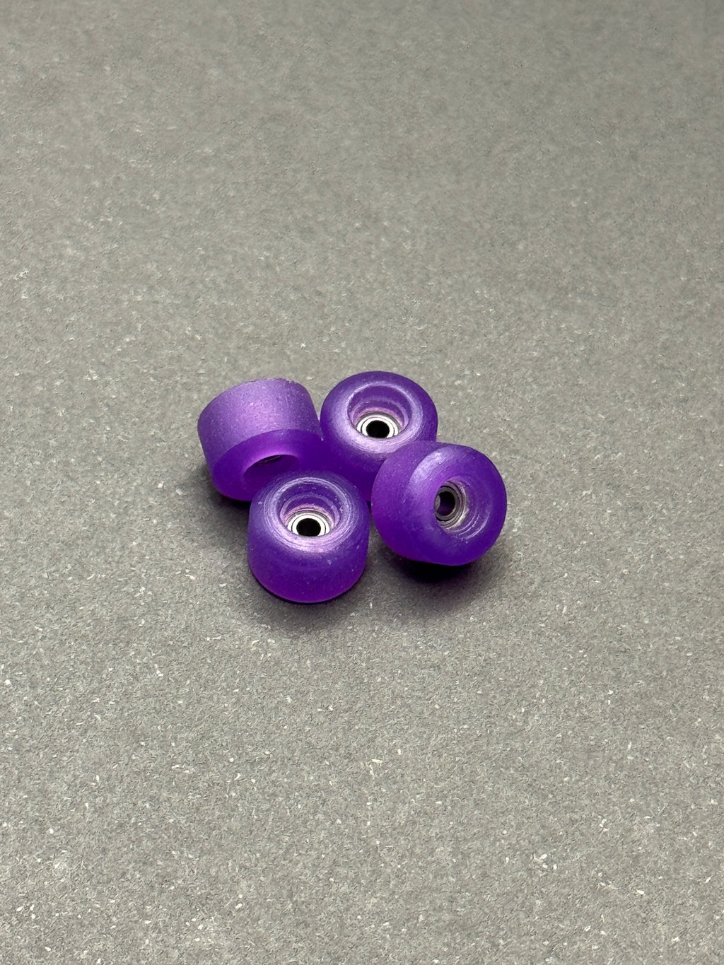 Abstract 7.75mm Conical Purple fingerboard wheels