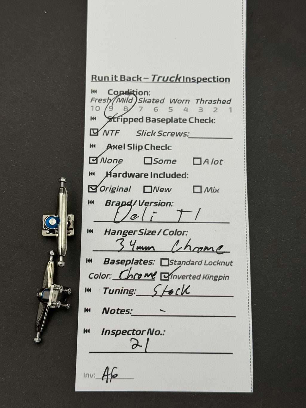 Deli T1 34mm Chrome trucks – inspection card