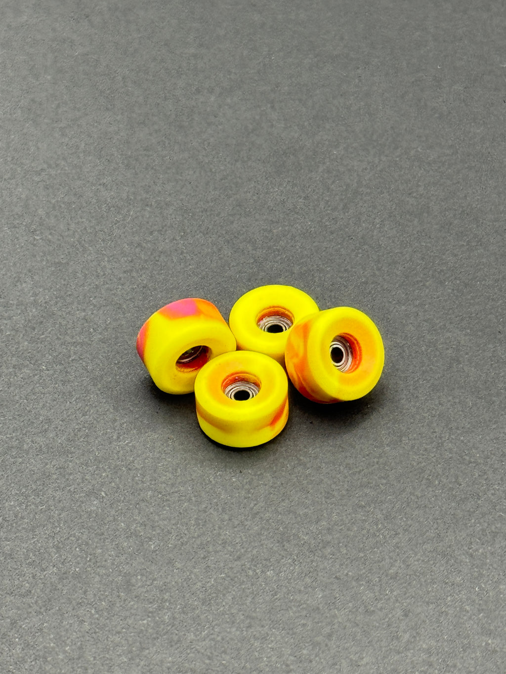 Abstract Bowl Pink/Yellow Swirl fingerboard wheels – product shot