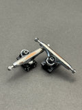 Dynamic 34mm Chrome Black trucks with inspection card