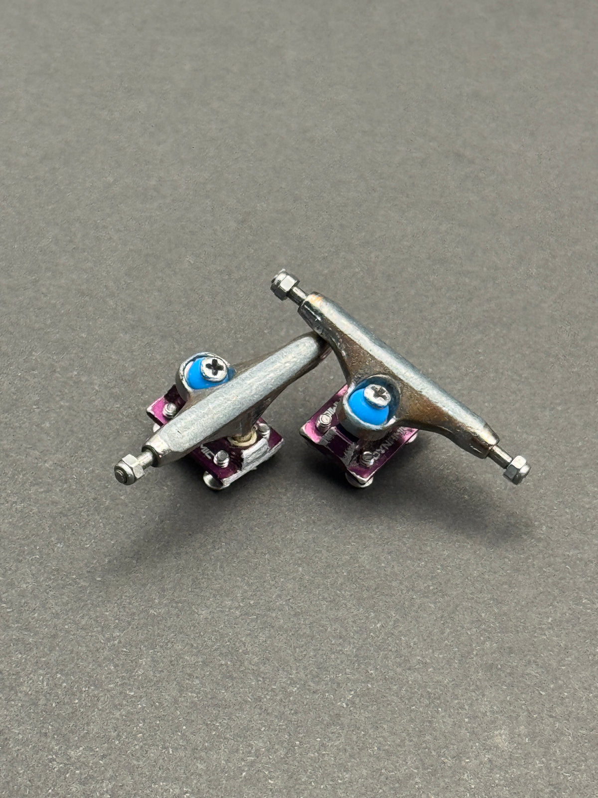 Dynamic 32mm Raw Purple trucks with inspection card