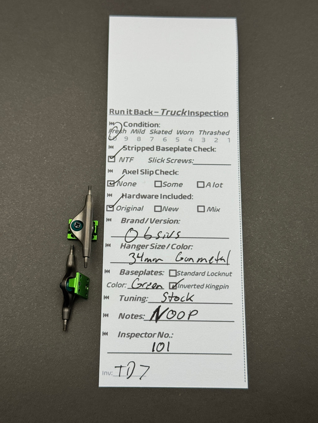 Obsins 34mm Gunmetal Green trucks with inspection card