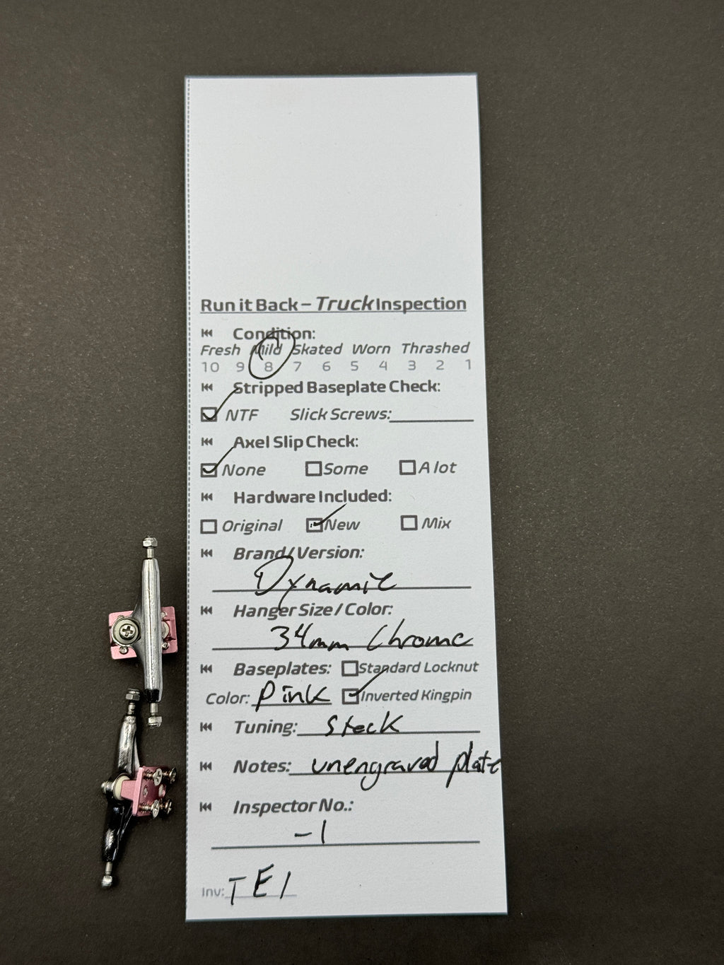 Dynamic 34mm Chrome Pink trucks with inspection card