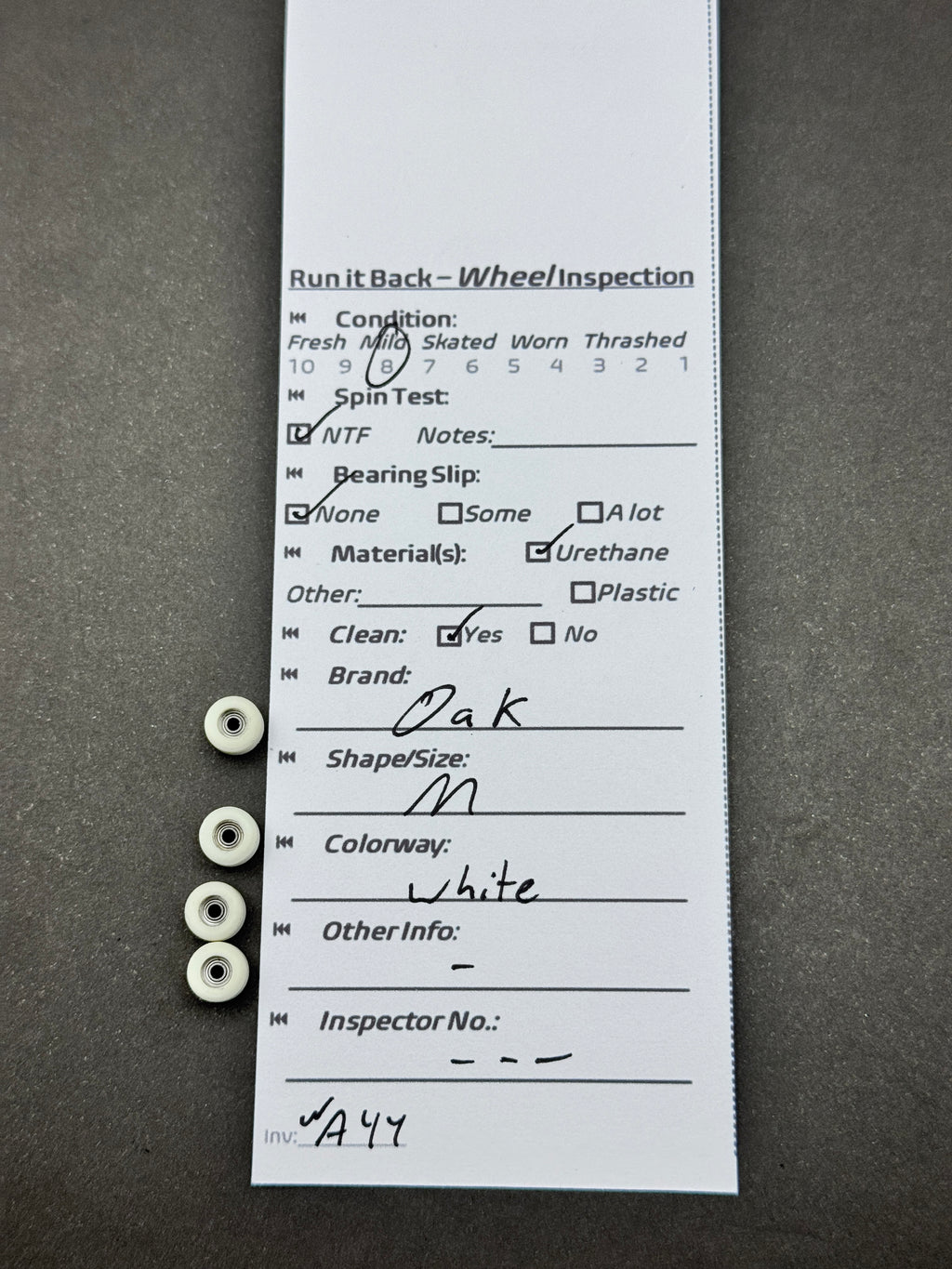 Oak M White fingerboard wheels inspection card